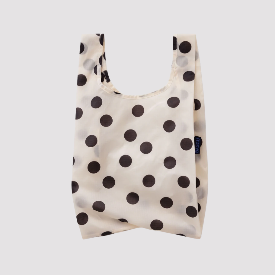 Reusable tote bag with black polka dots on off-white fabric