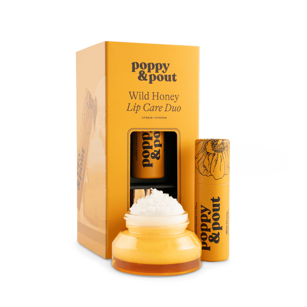 Lip care duo set with Wild Honey balm jar, lip scrub tube, and gift box