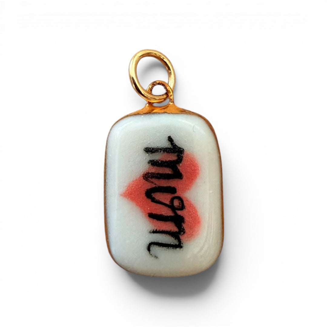 Porcelain mom love charm with gold loop, red heart and 'Mom' text