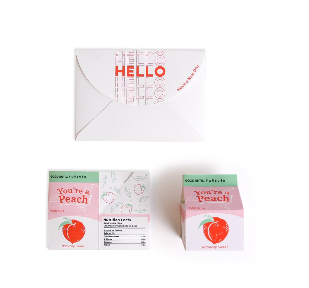 Juice box pop-up greeting card front view with white 'HELLO' and peach insert