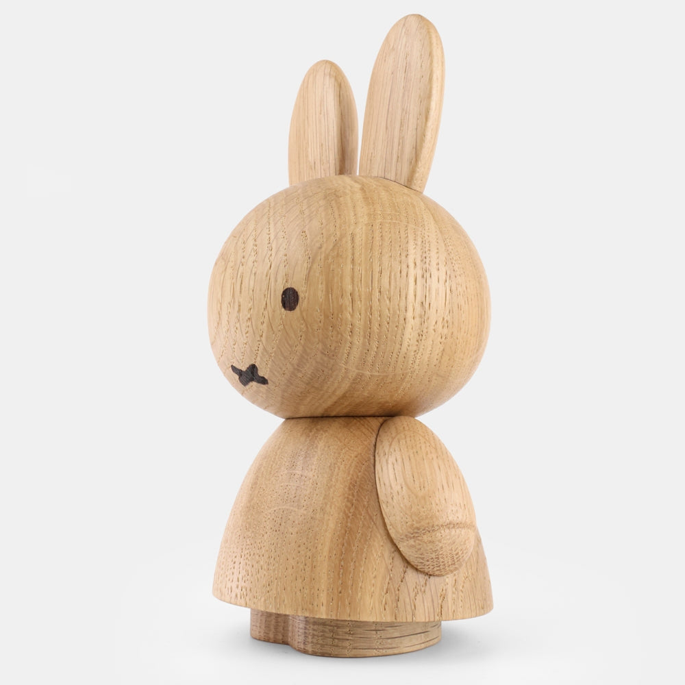 Mini oak wood bunny figurine with one raised arm, carved eyes and whiskers