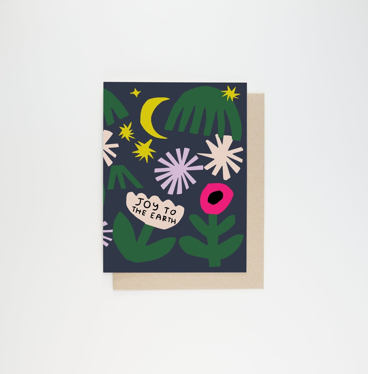 Greeting card with dark blue background, green leaves, yellow moon, stars, and 'Joy to the Earth'.