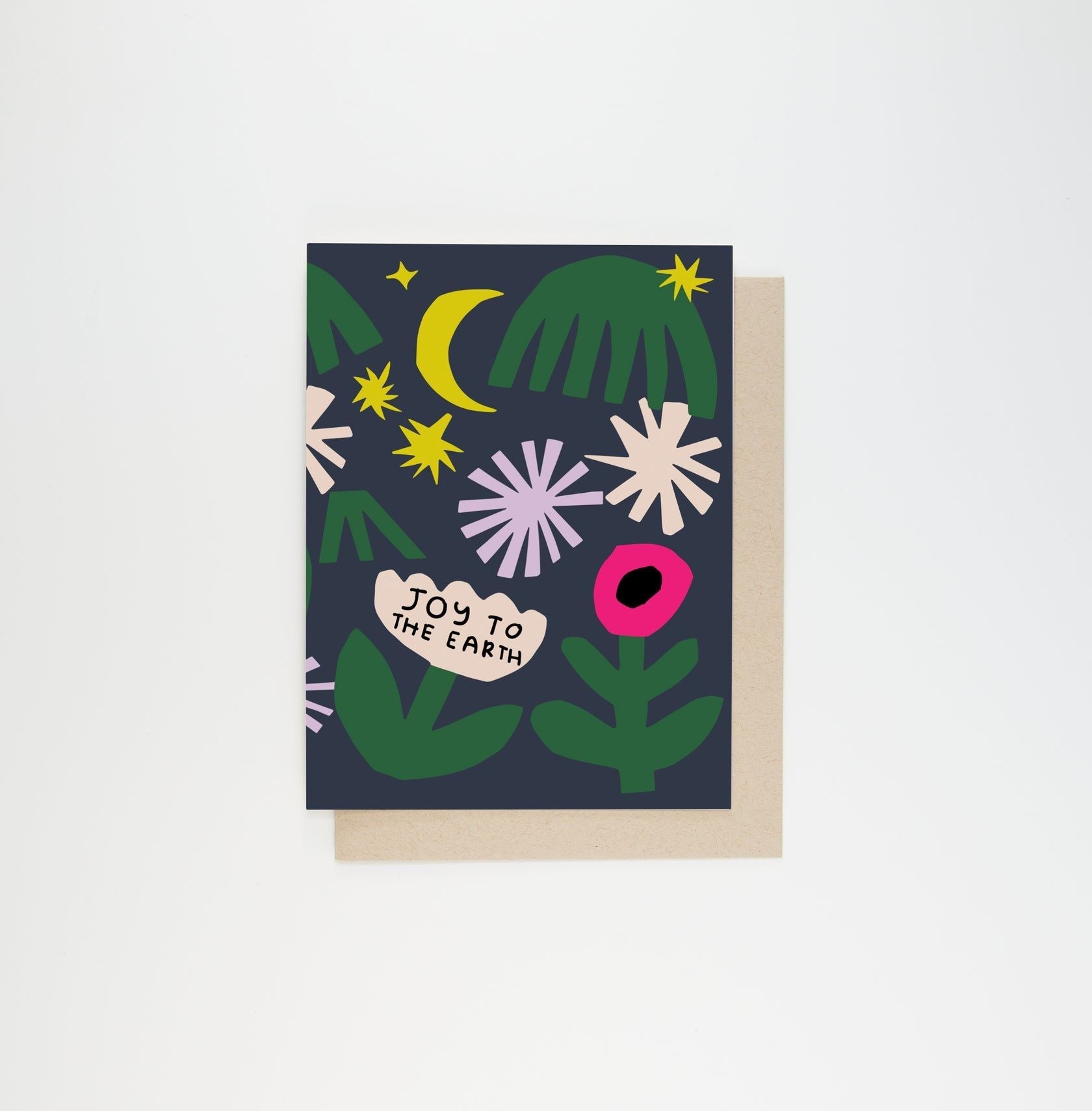 Greeting card with dark blue background, green leaves, yellow moon, stars, and 'Joy to the Earth'.