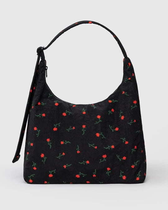 Black nylon shoulder bag with red floral print and curved top handles