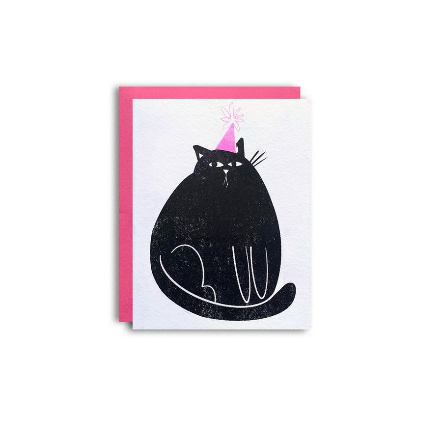 Birthday greeting card with black cat wearing a pink party hat on a white background