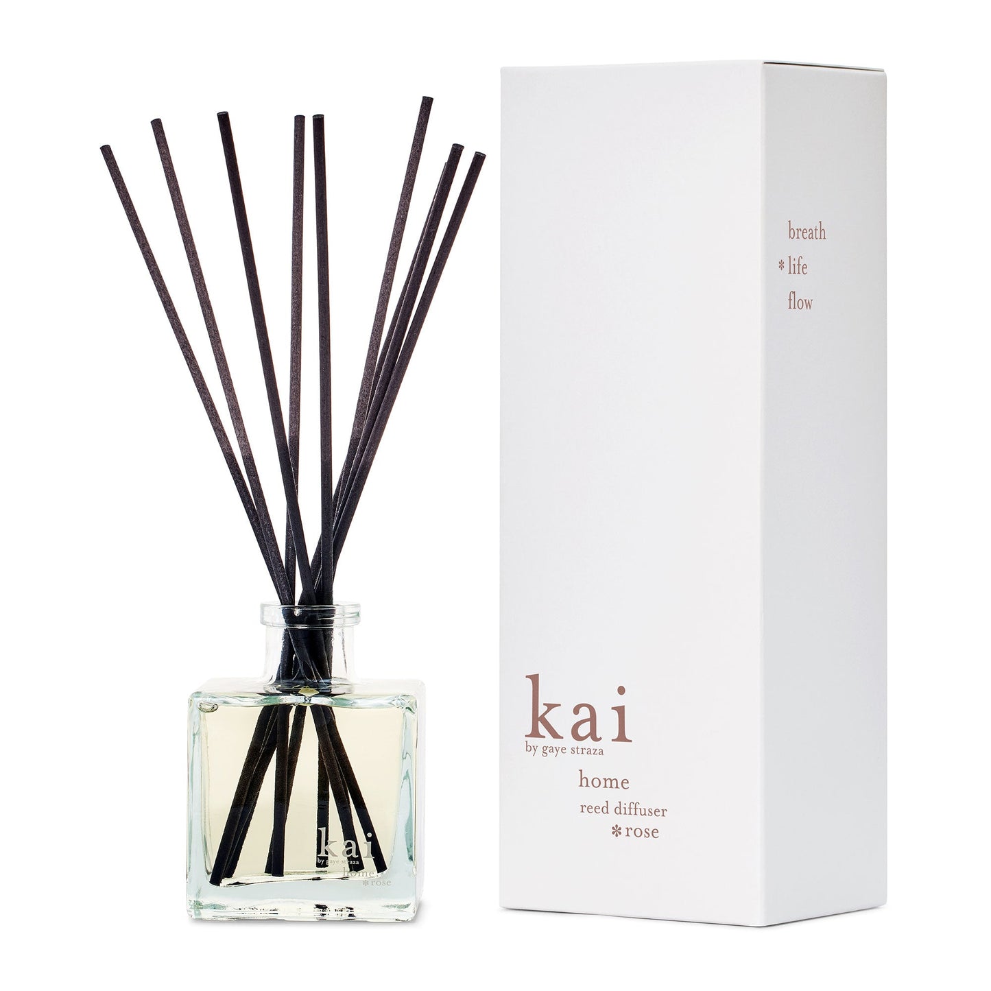Glass reed diffuser bottle with black reeds and matching white retail box