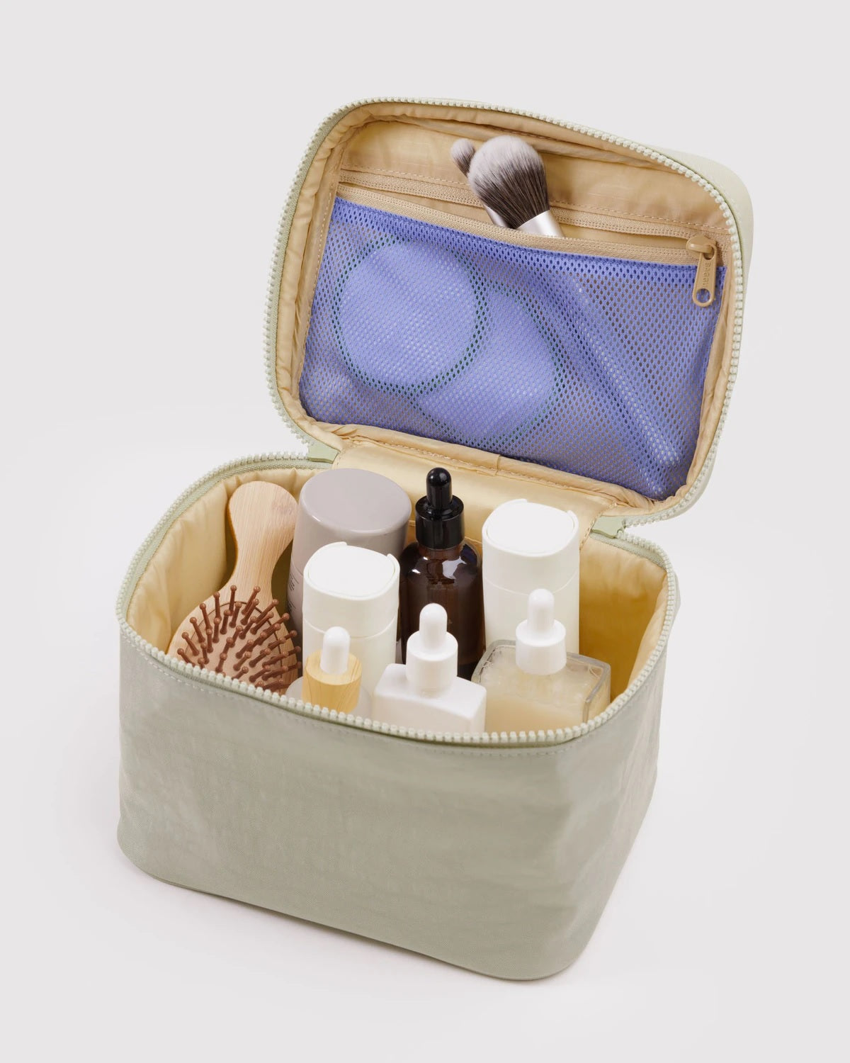Large cosmetic case open with interior pockets and mesh divider