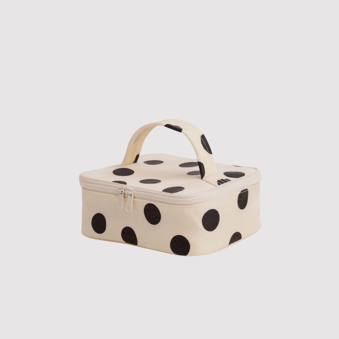 Small cosmetic case, cream with large black polka dots, zip top and handle