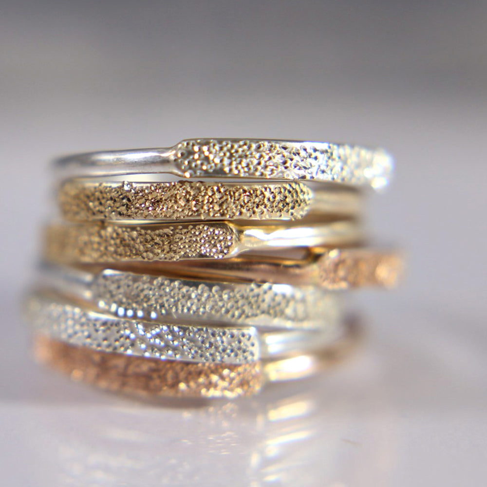 Narrow diamond-dusted gold-filled ring with slim gold band and sparkly texture