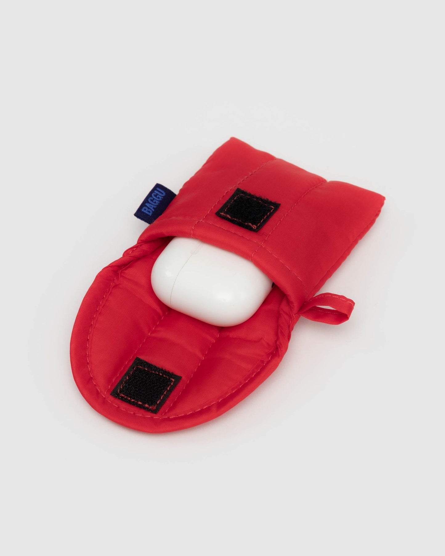 Red puffy earbuds case with earbuds inserted and two small black window accents