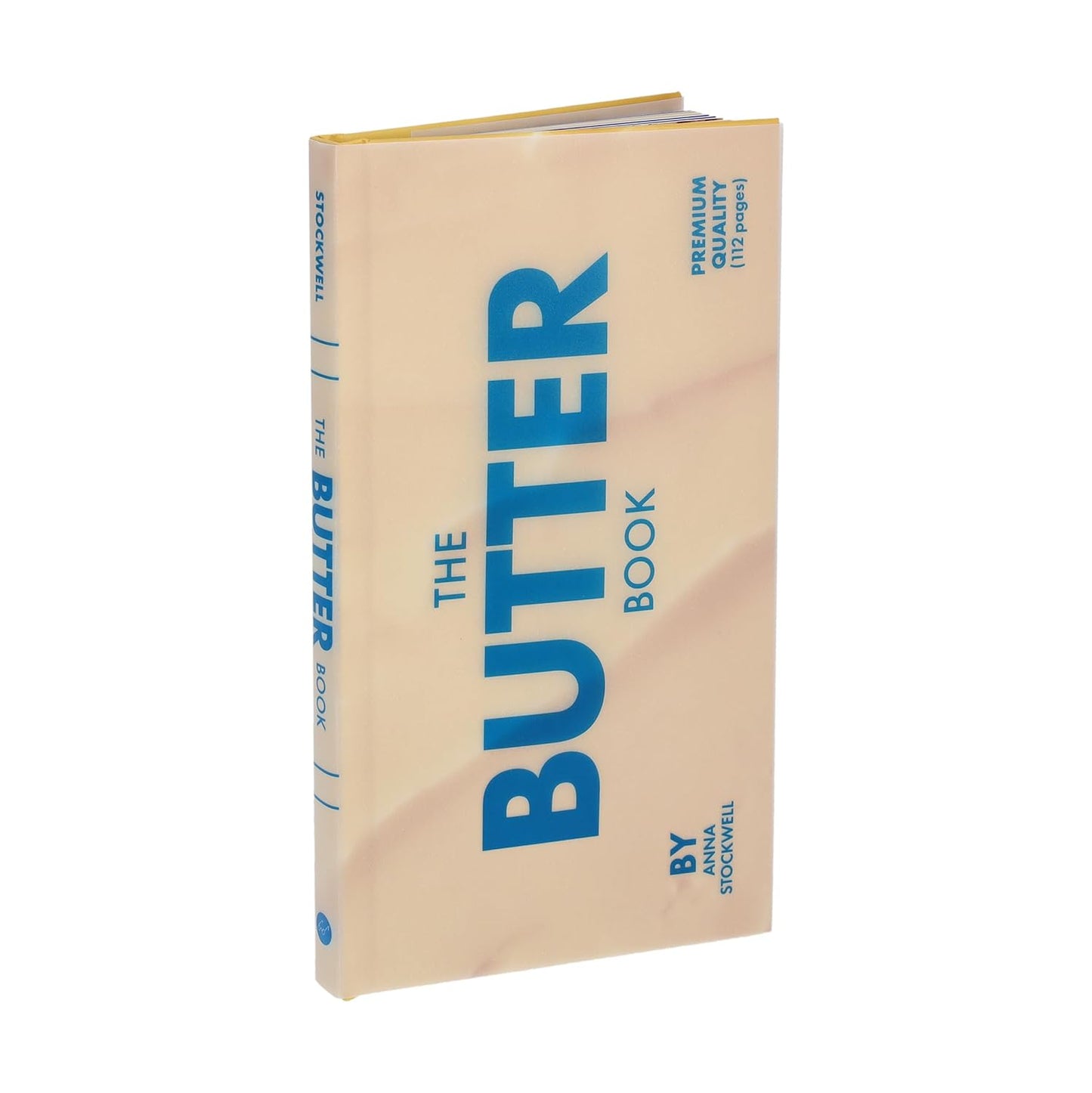 The Butter Book cookbook with cream cover and blue title text, side spine visible.