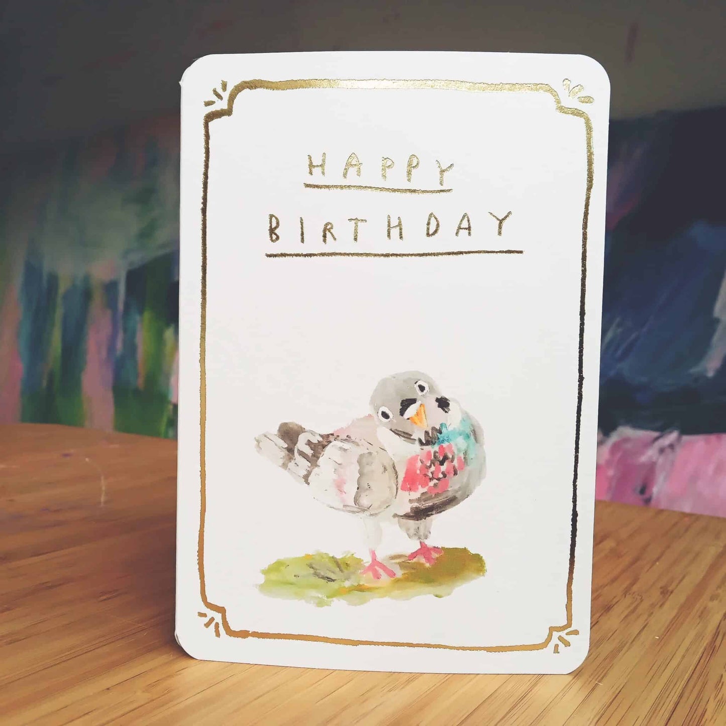 Gold birthday pigeon greeting card, white with gold border, Happy Birthday text and pigeon art