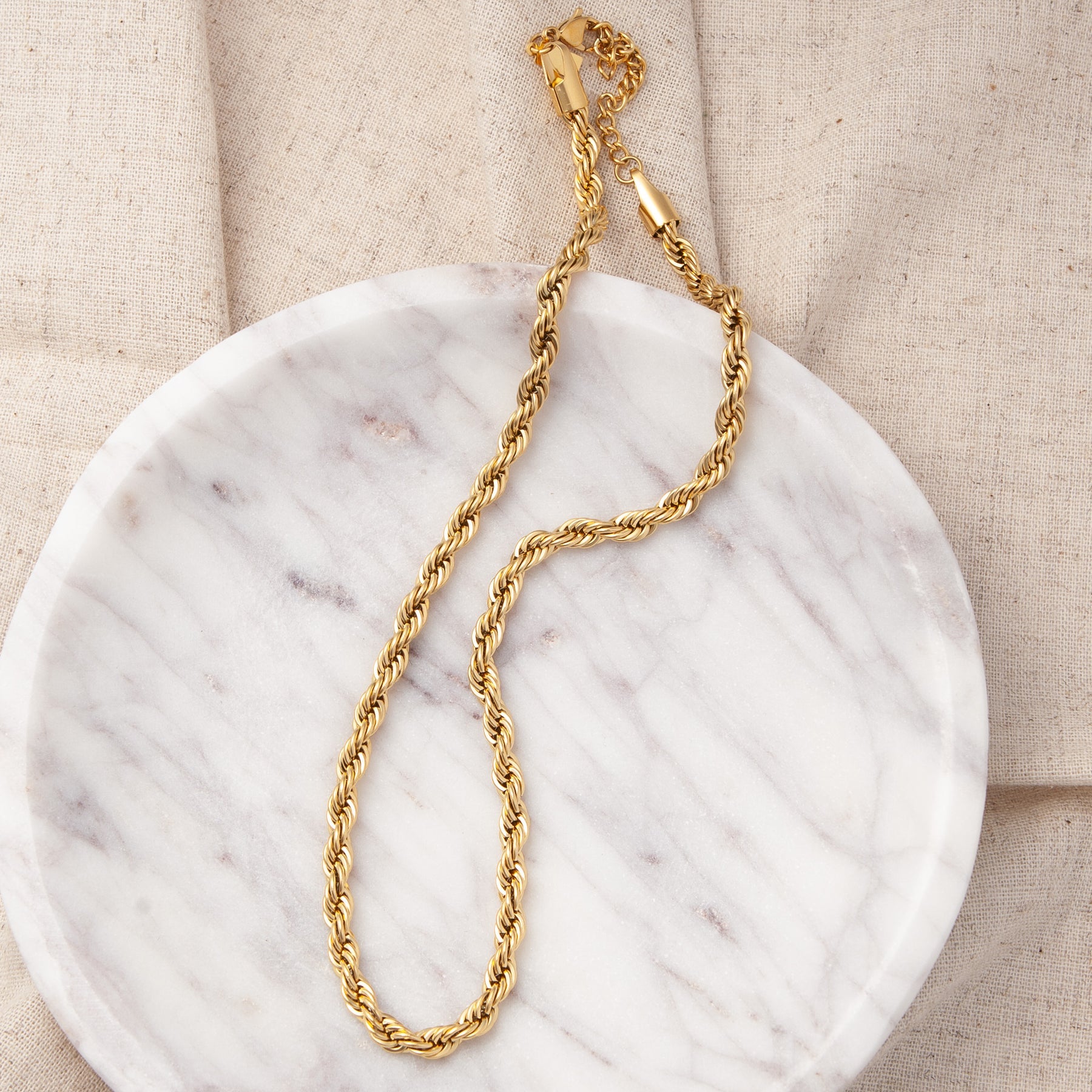 Gold-tone rope chain necklace with small clasp and chain detail