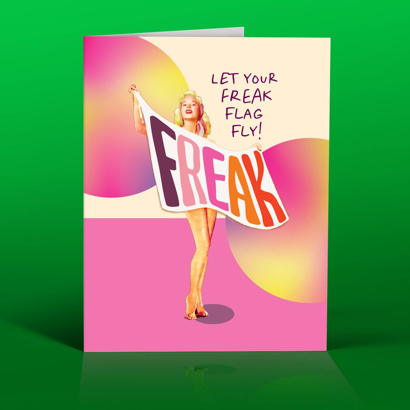 Greeting card cover: woman holding “FREAK” flag with text “LET YOUR FREAK FLAG FLY!”