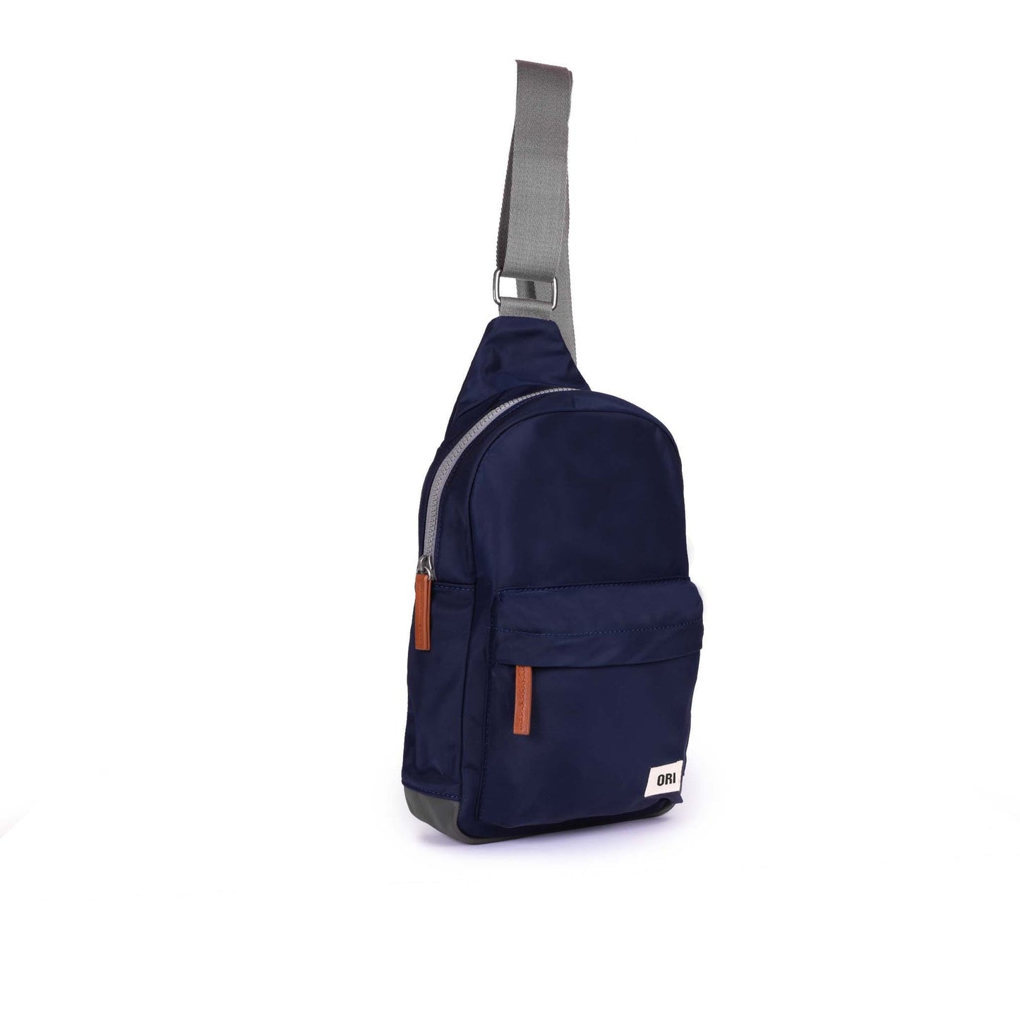 Large dark blue sling bag with front pocket, adjustable strap, and side zipper pull