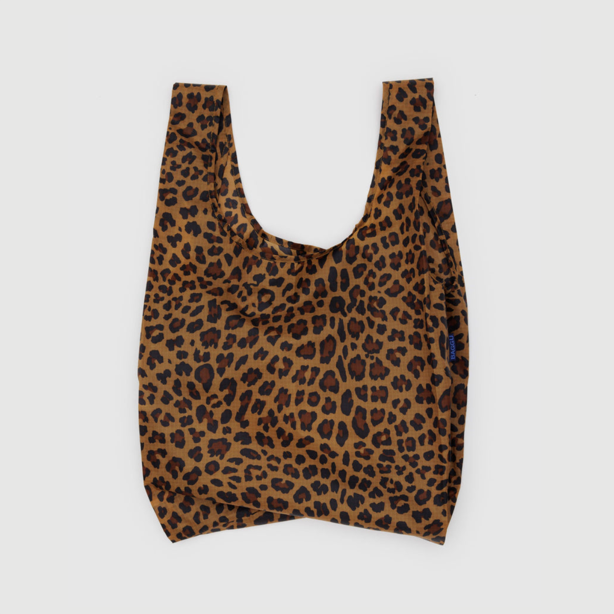 Reusable tote bag in brown with leopard-print pattern and short U-shaped handles.