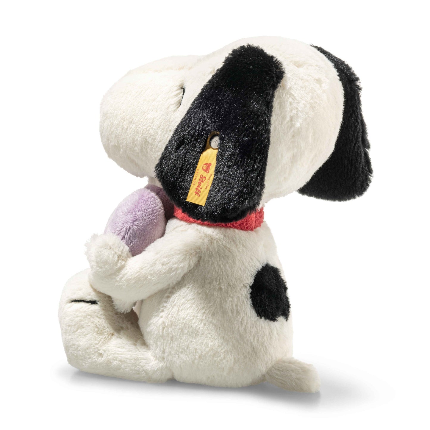 Plush dog toy looking sideways with red collar and purple Heartbreakers Club heart