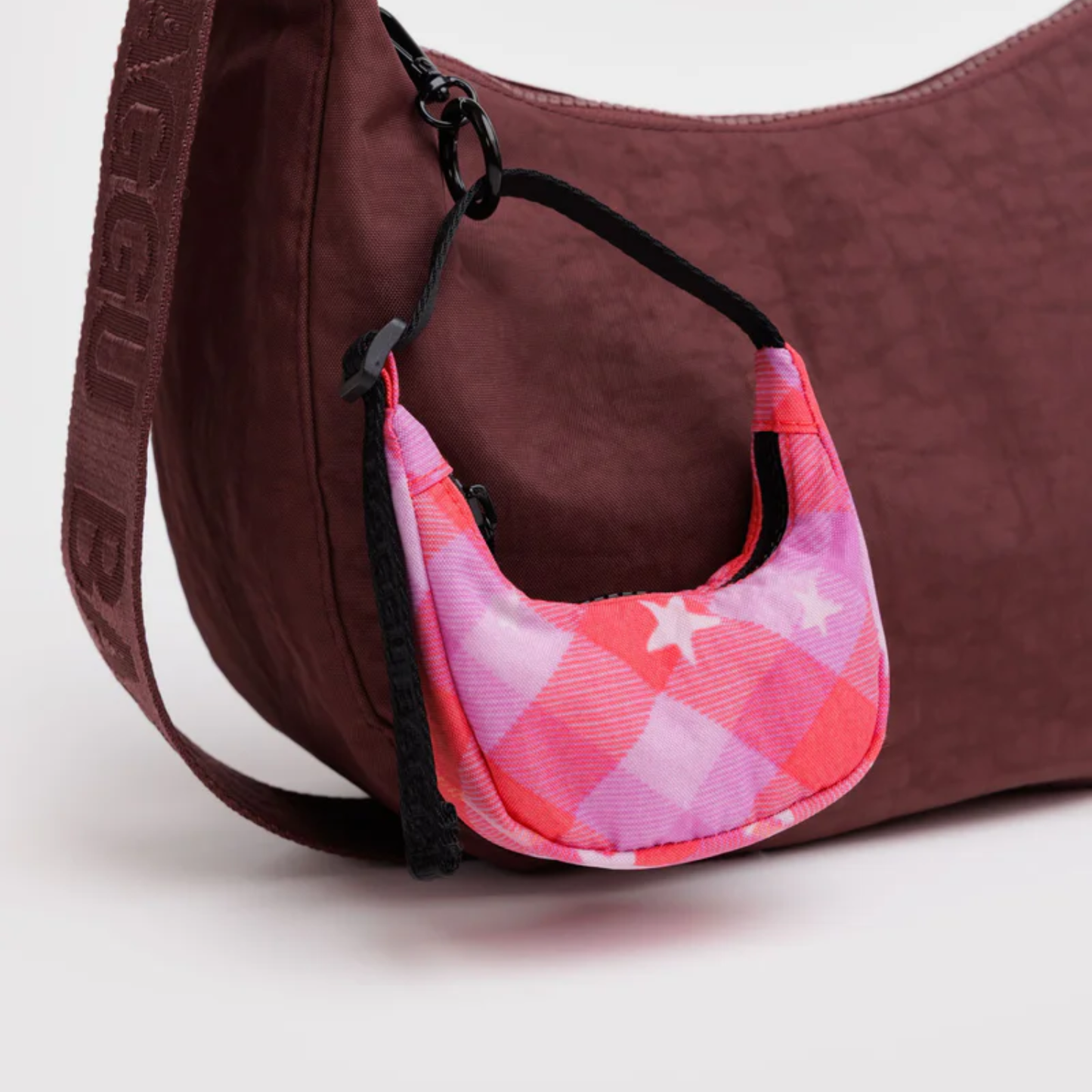 Pink star plaid crescent bag charm with black drawstring loops