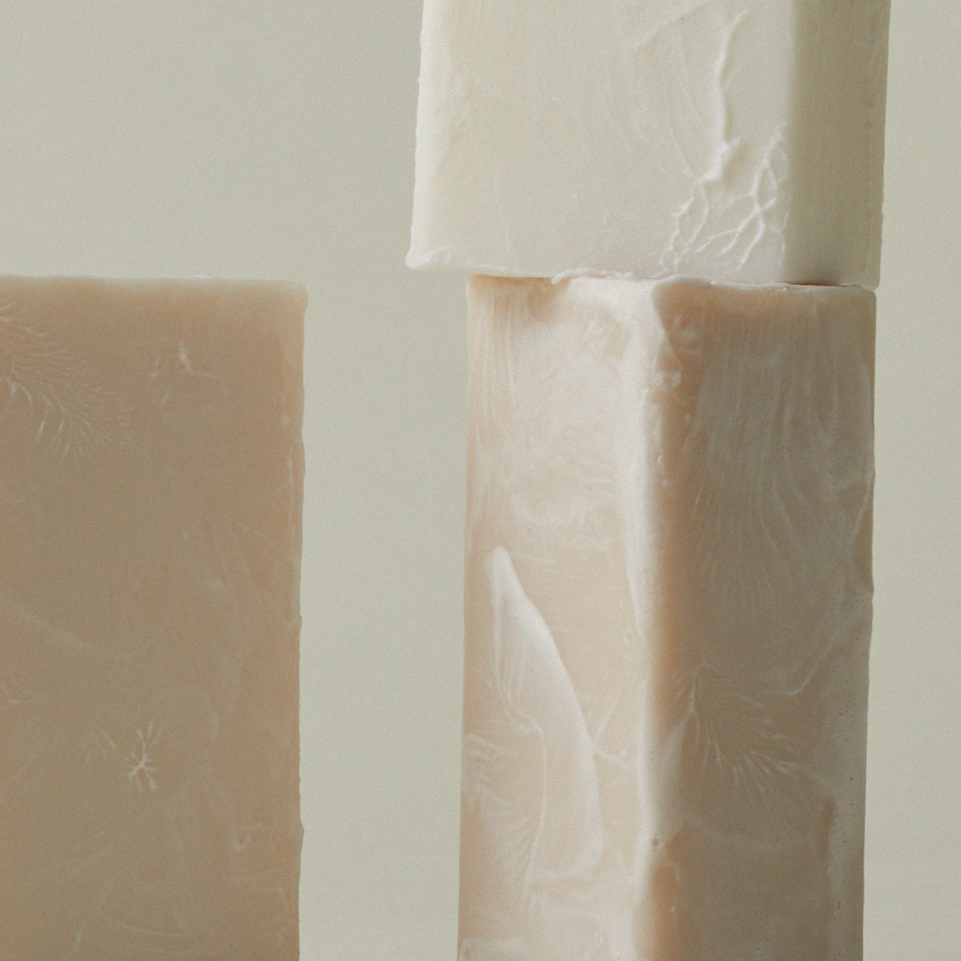 Mini soap bar with embossed leaf texture on two stacked bars