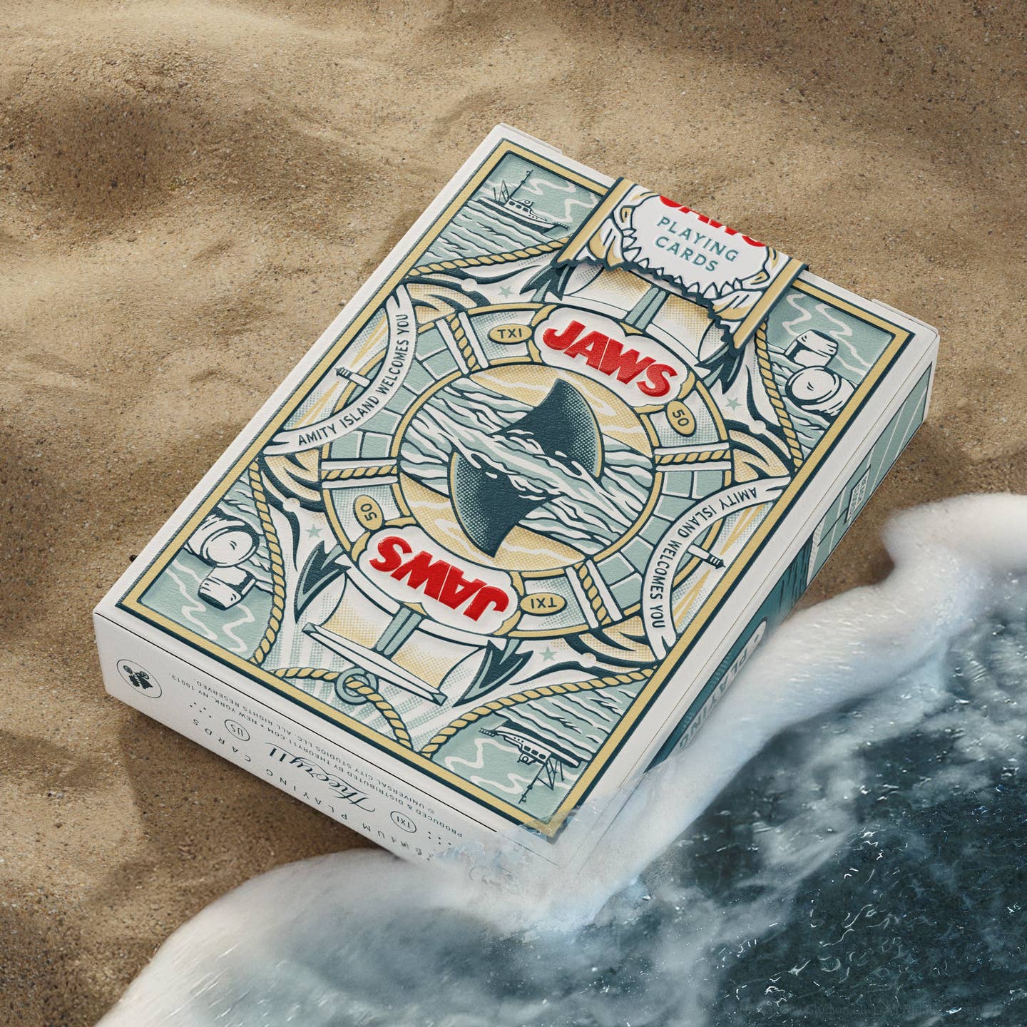 Playing cards deck box top view with JAWS-themed illustrations on the lid and card backs