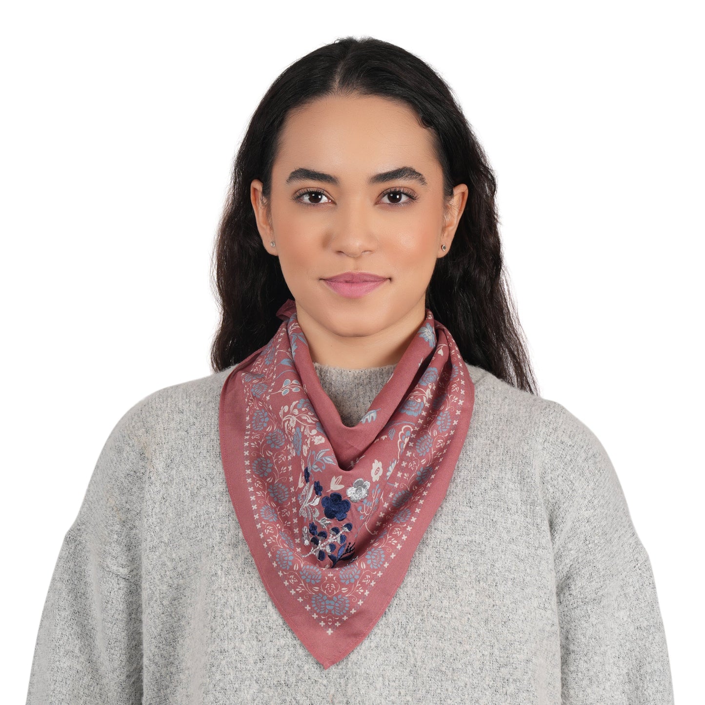 Dusty rose floral cotton scarf worn as a neck scarf with matching border
