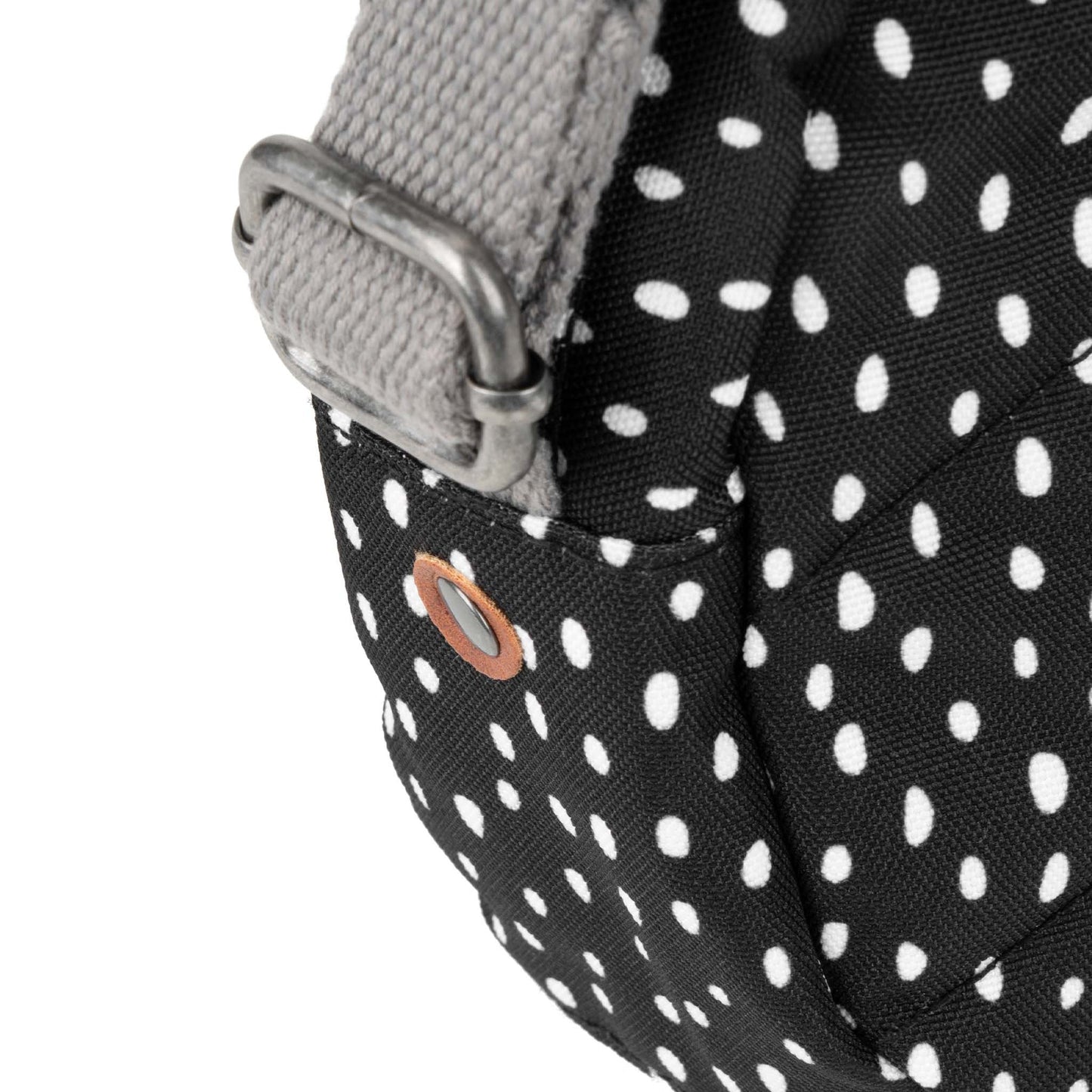 Recycled canvas crossbody bag close-up, black speckle fabric with metal strap clip