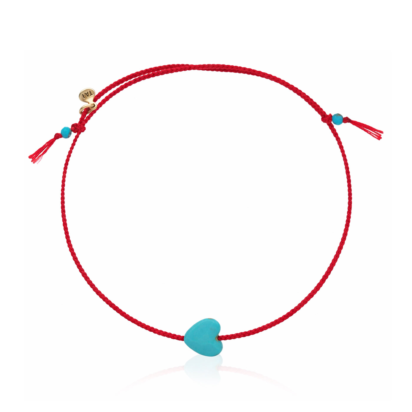 Red cord bracelet with turquoise heart charm and small turquoise bead accents