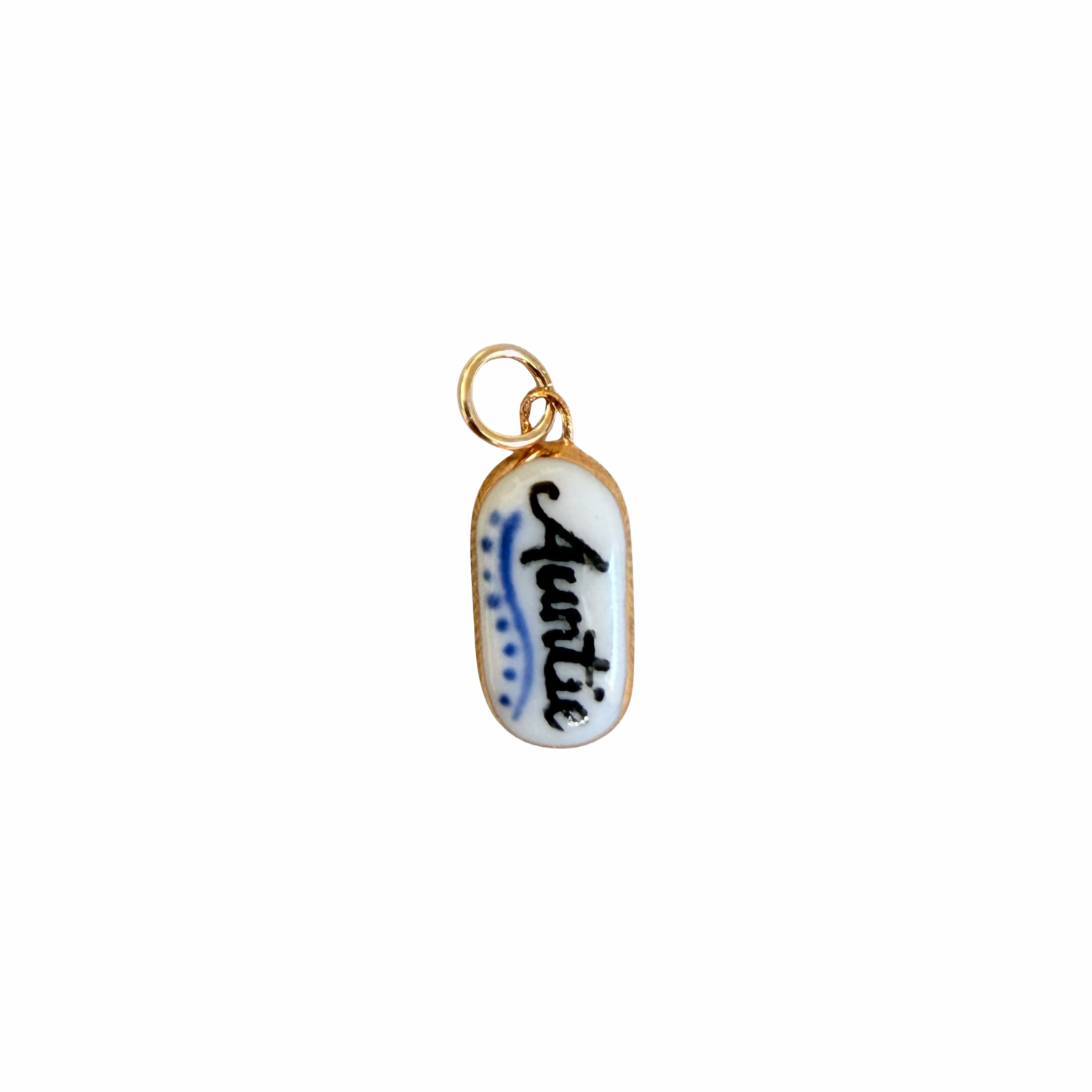 Porcelain auntie charm with gold loop and blue-and-black stamped design, oval shape