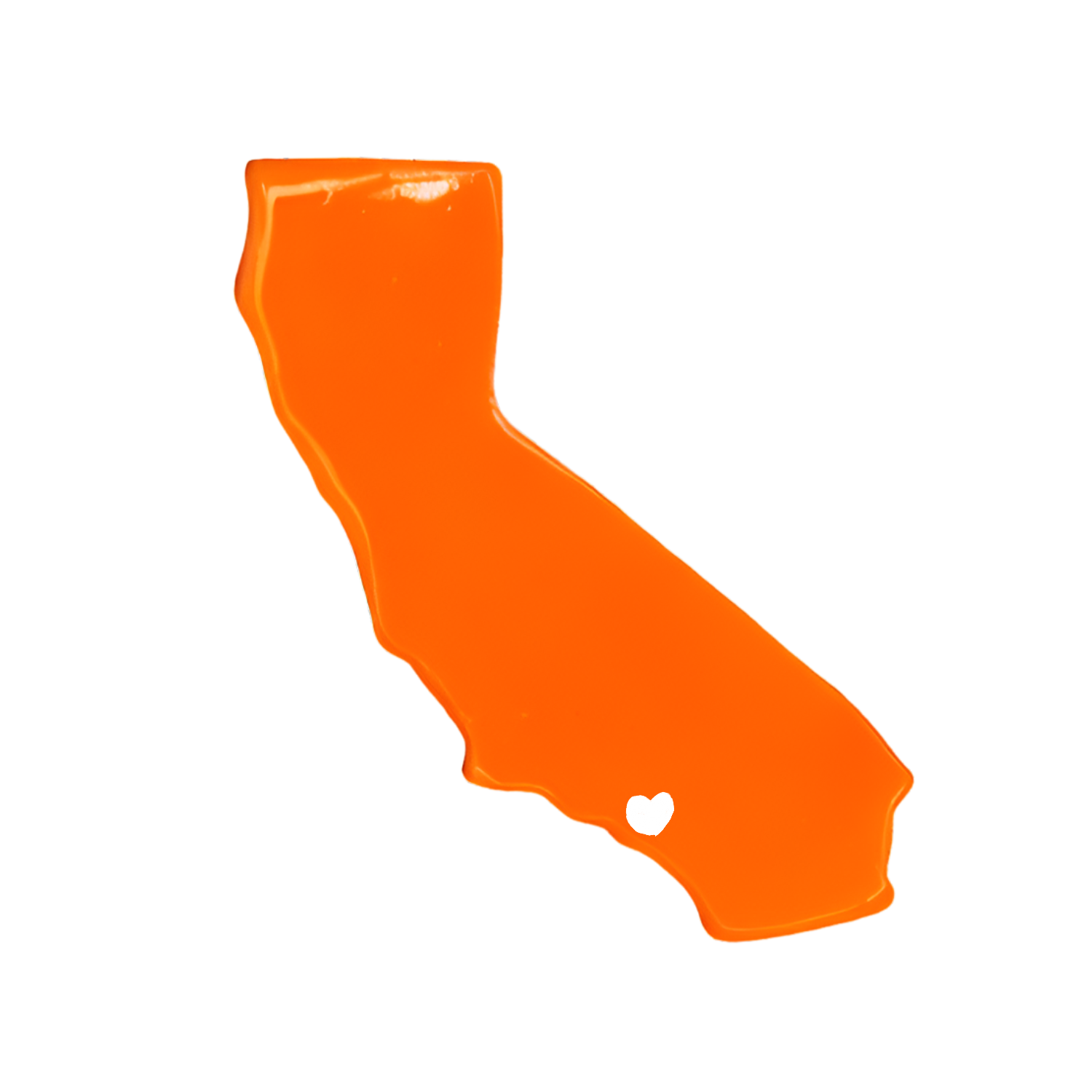 Orange ceramic Los Angeles map magnet with small white heart near the center.