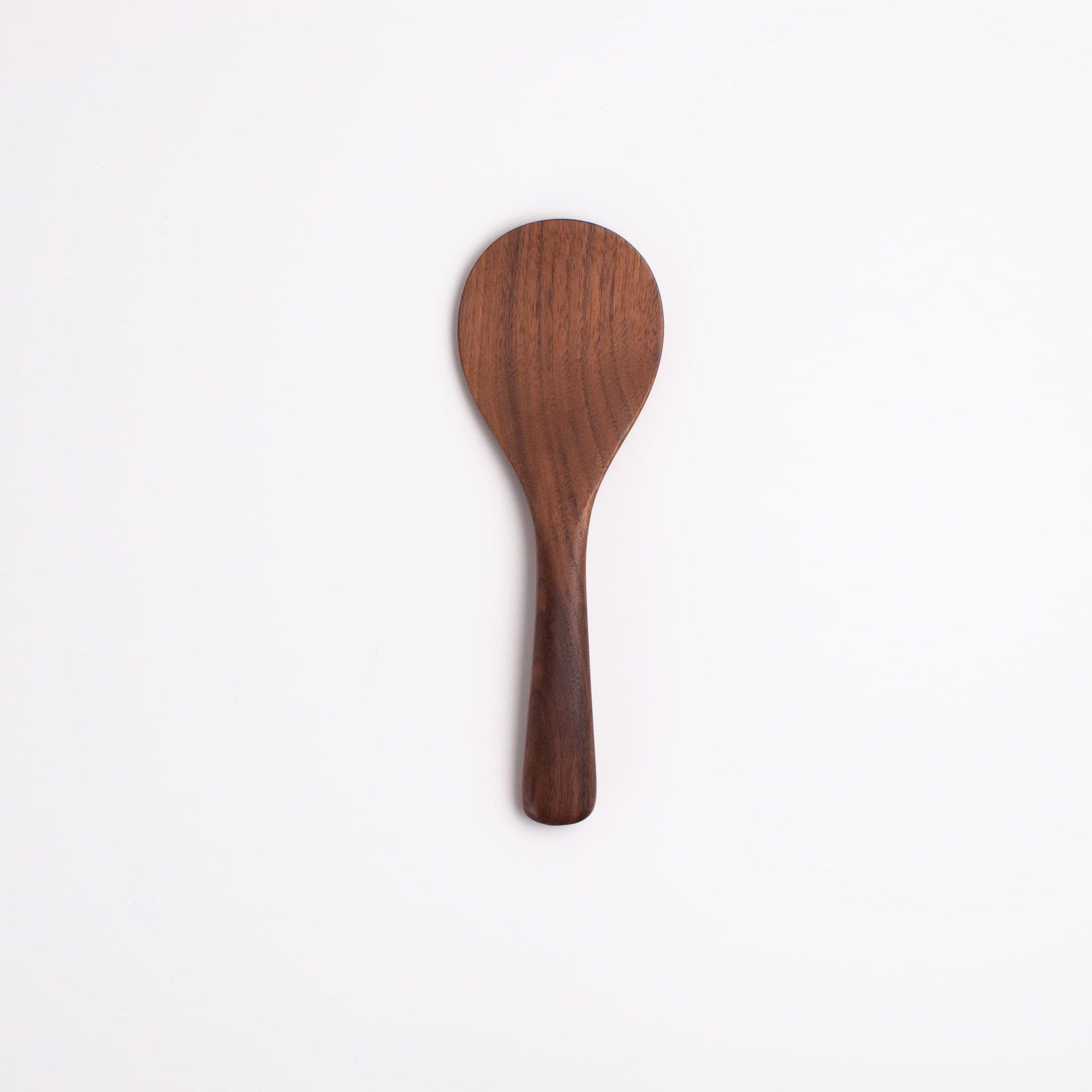 Walnut wood rice paddle with rounded scoop end and long handle