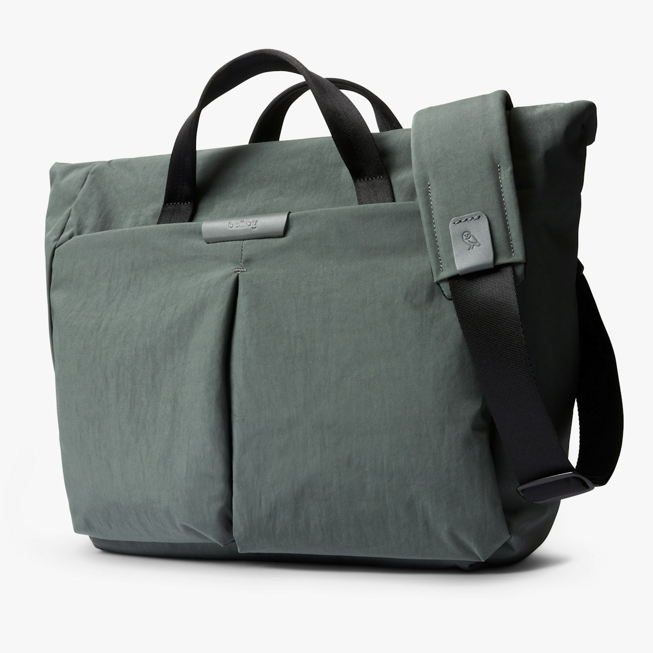 Everglade green messenger bag with top handle, side pocket, and crossbody strap.