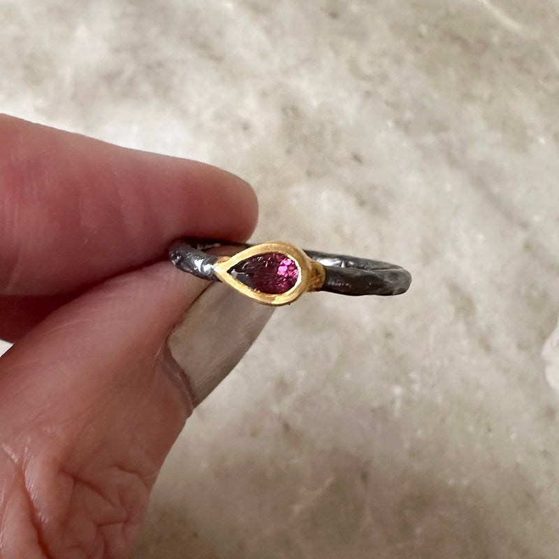 Oxidized silver ring with pink tourmaline in gold vermeil bezel, side view