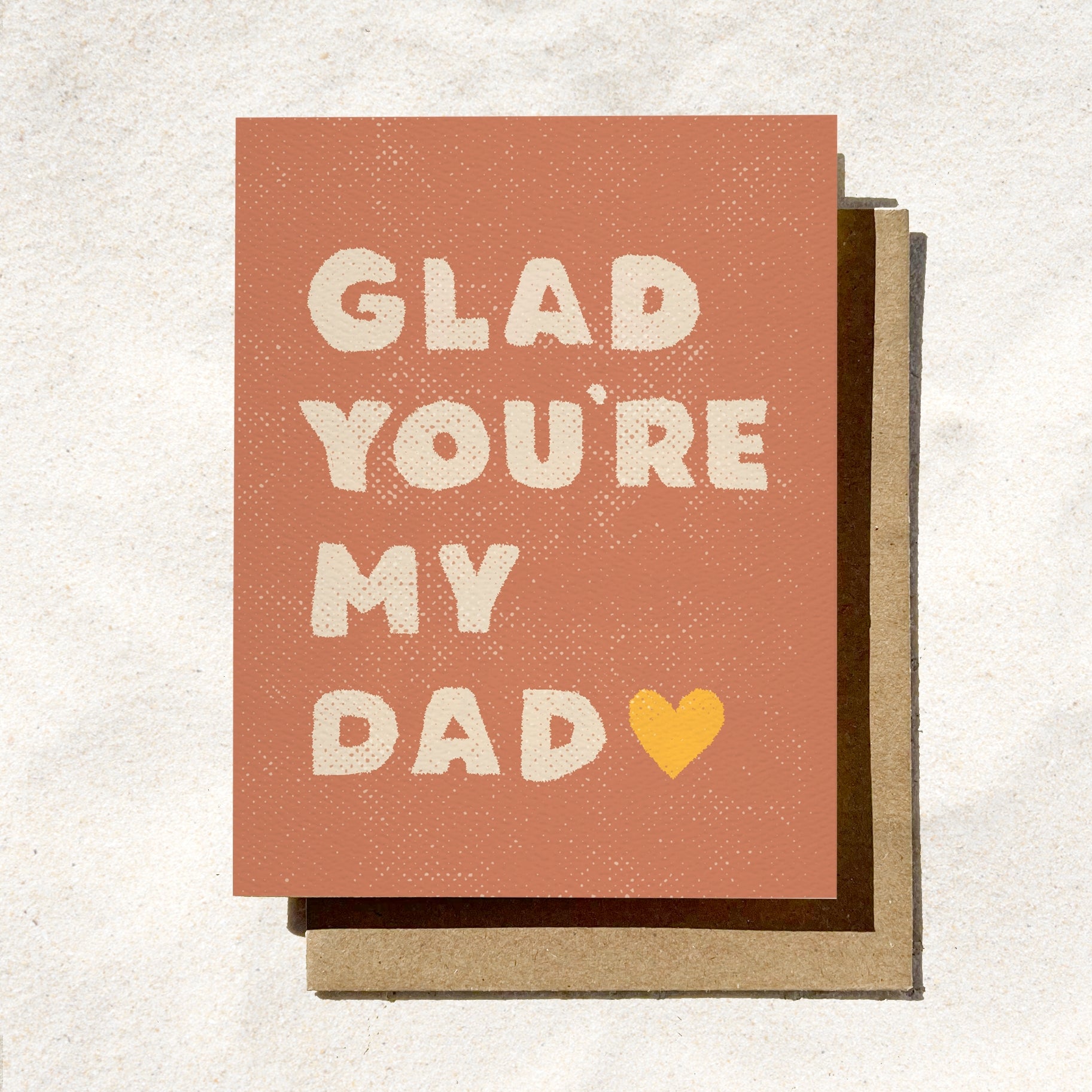 Father's day greeting card with 'GLAD YOU'RE MY DAD' text and heart