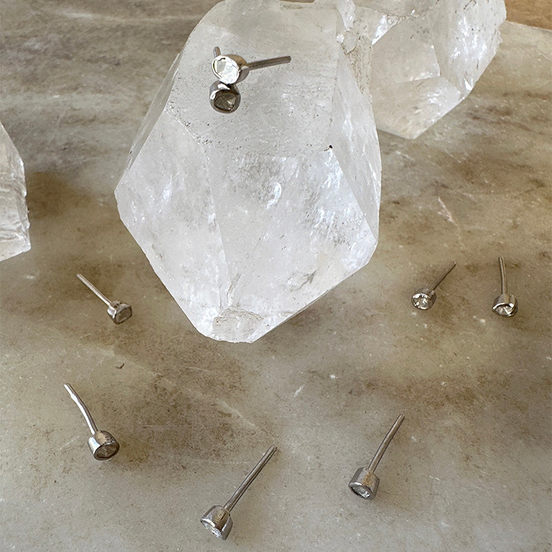 Sterling silver polki diamond stud earrings with small round faceted stones and posts