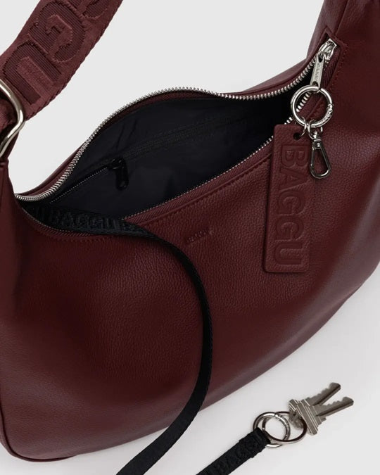 Medium recycled leather crescent bag interior with zip, logo tag, and key ring