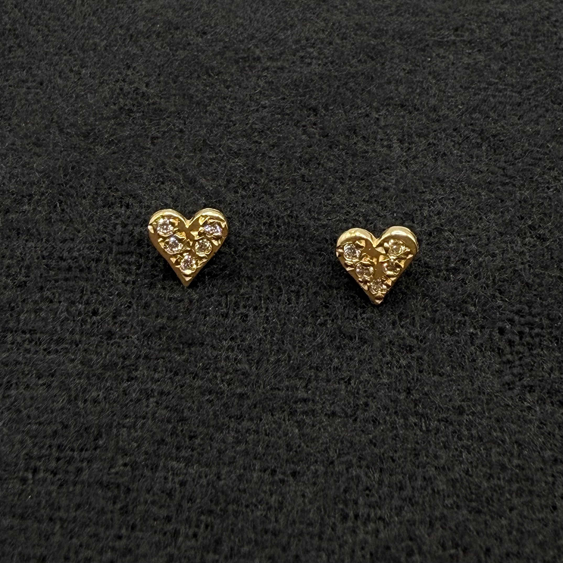 Pave diamond heart stud earrings in 14 karat gold