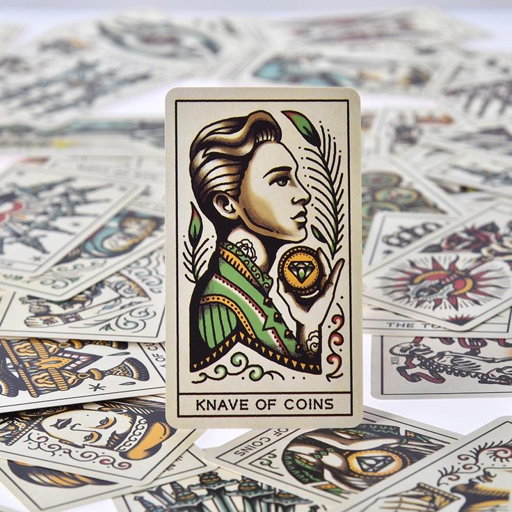 Tarot card labeled "Knave of Coins" with portrait and laurel, with other cards behind
