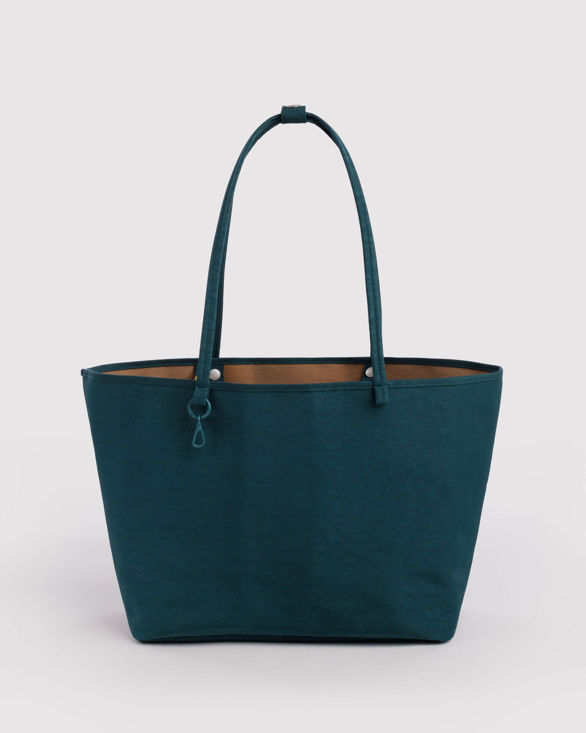 Large nylon reversible tote in deep teal with top handles and small front pocket tab