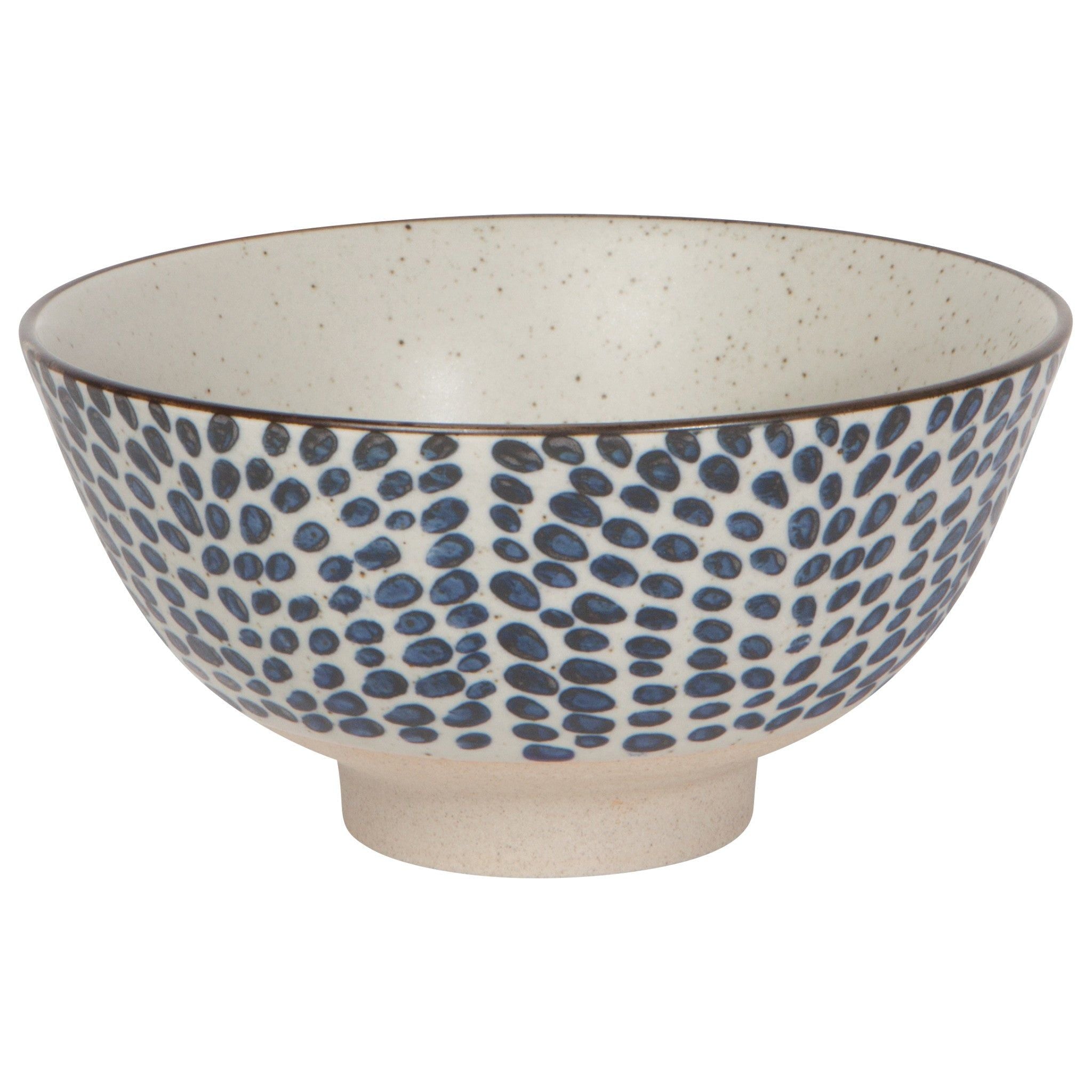 Large ceramic bowl with speckled cream glaze and blue droplet dot pattern; open bowl