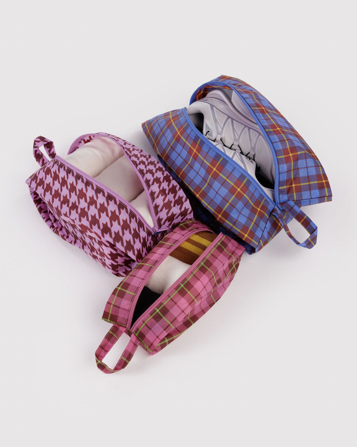 3D zip set with plaid and houndstooth prints in pink, purple, and blue