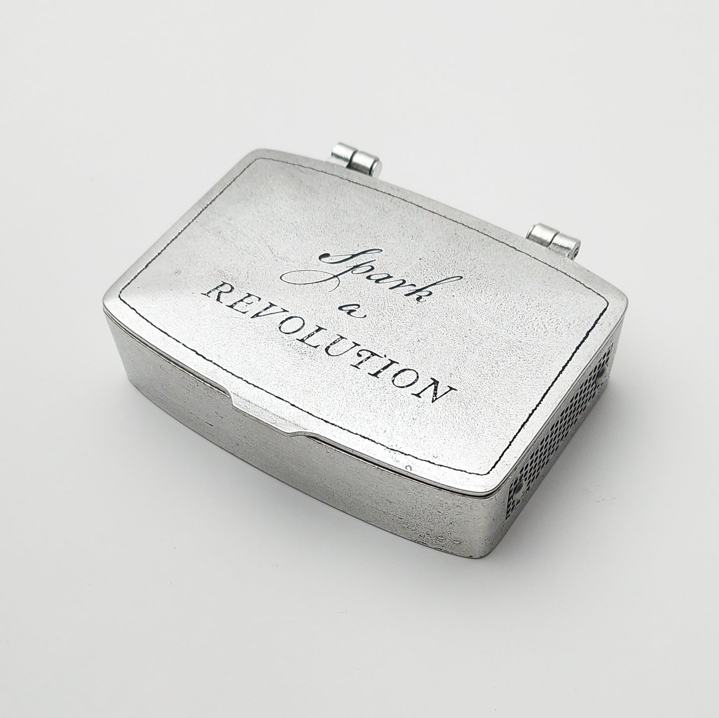 Metal matchbox tin with hinged lid, 'Spark Revolution' printed on top