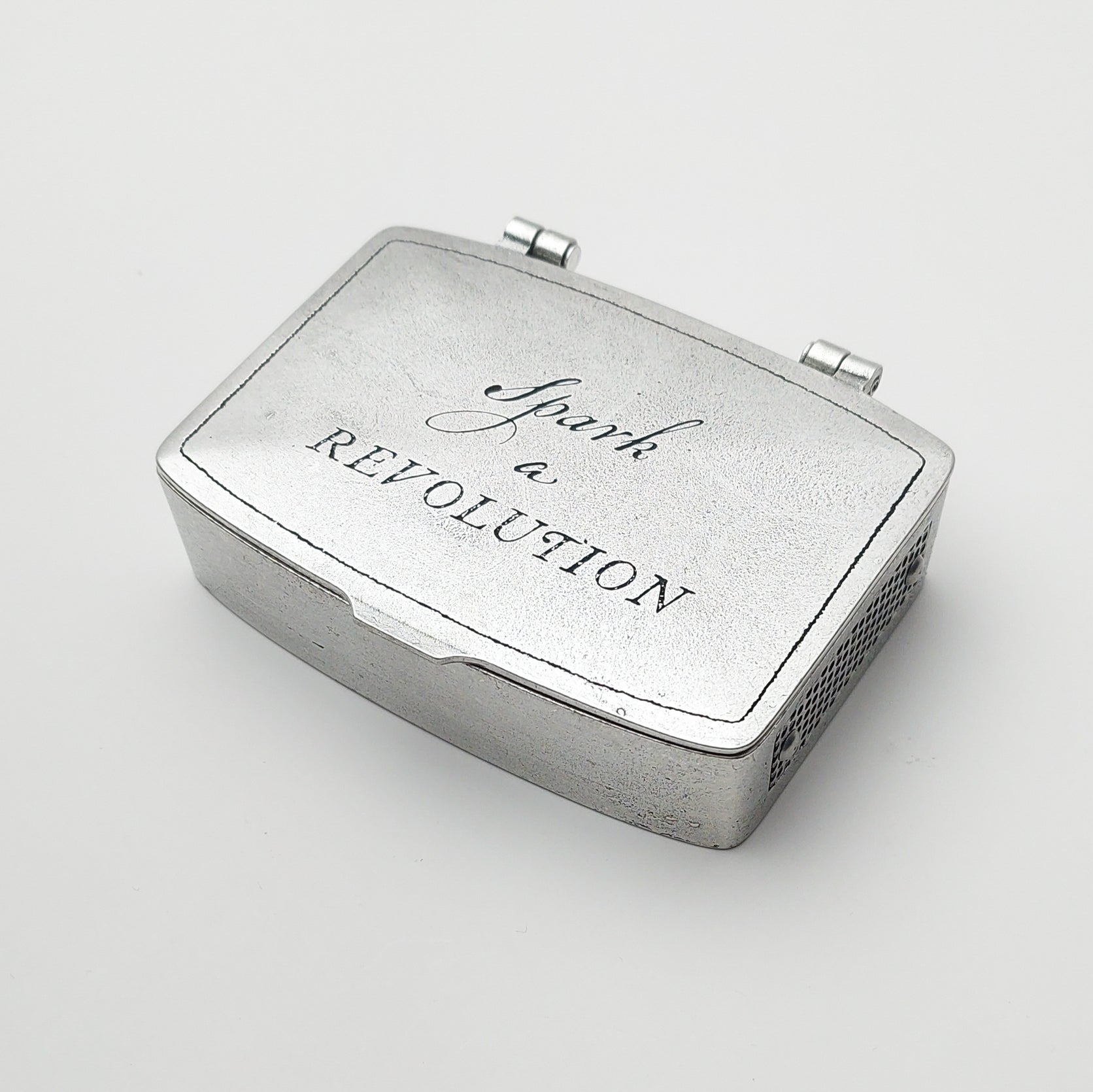 Metal matchbox tin with hinged lid, 'Spark Revolution' printed on top