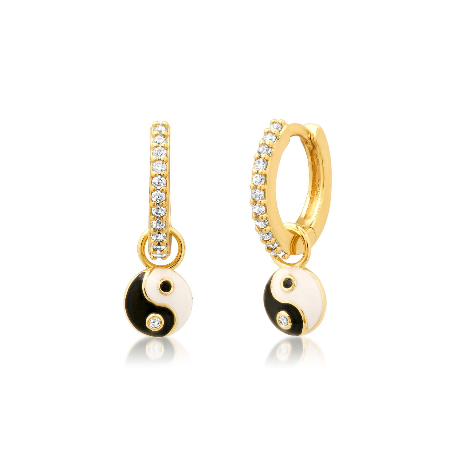 Gold huggie hoop earrings with yin yang charm and clear rhinestone accents
