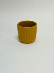Ribbed yellow ceramic plant pot