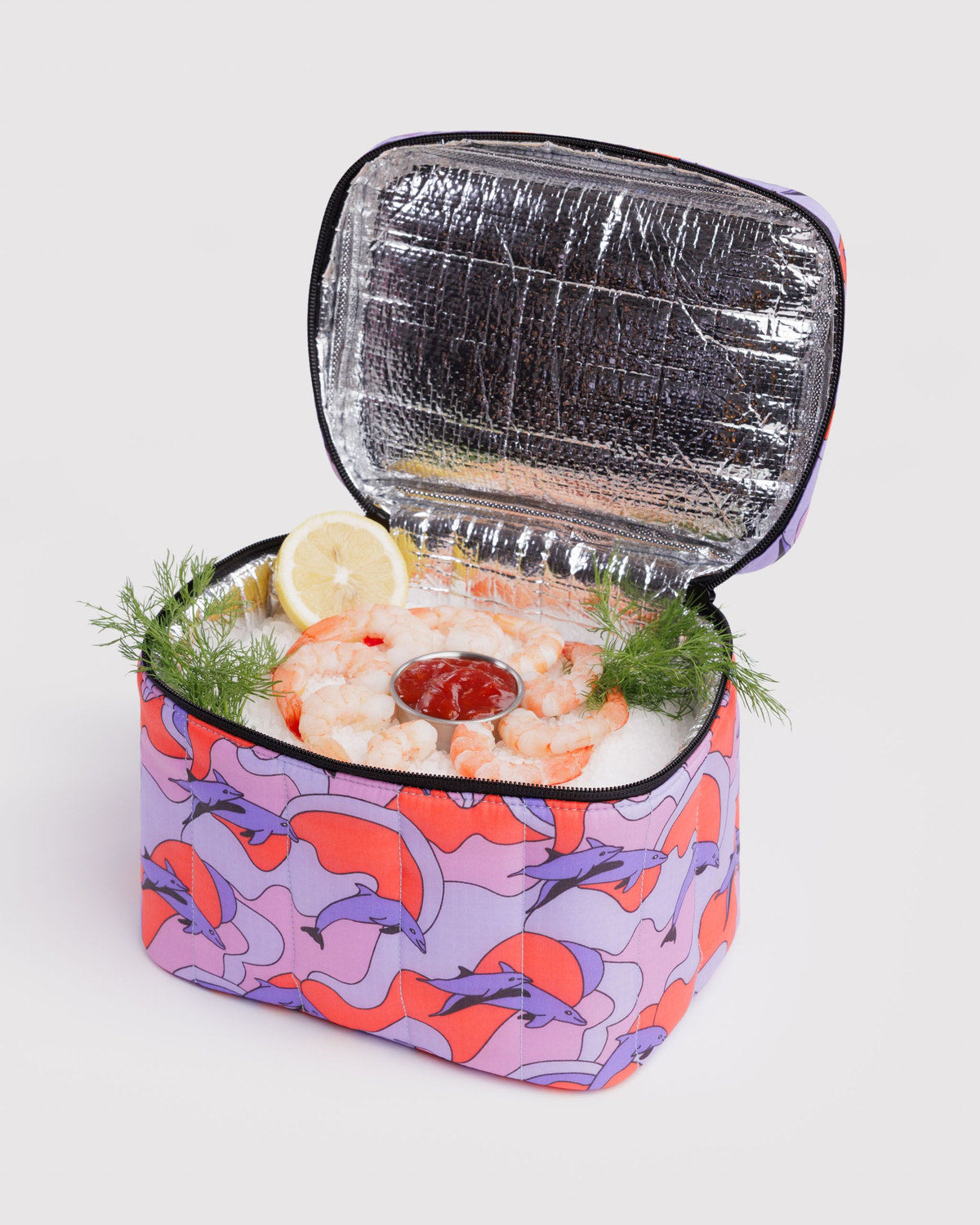 Puffy lunch bag with open top and silver lining, shrimp and lemon inside