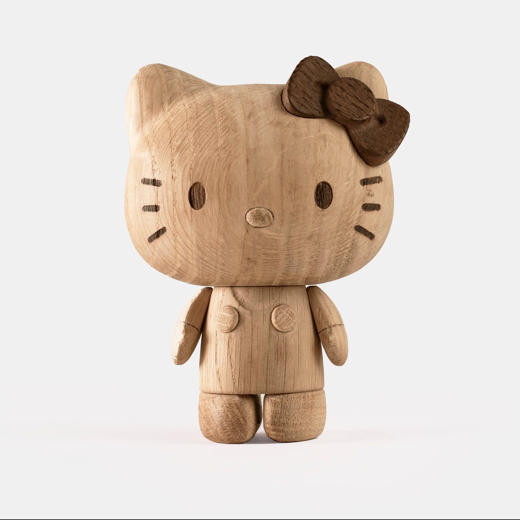 Hello Kitty wooden figurine with bow, full-body front view, arms at sides