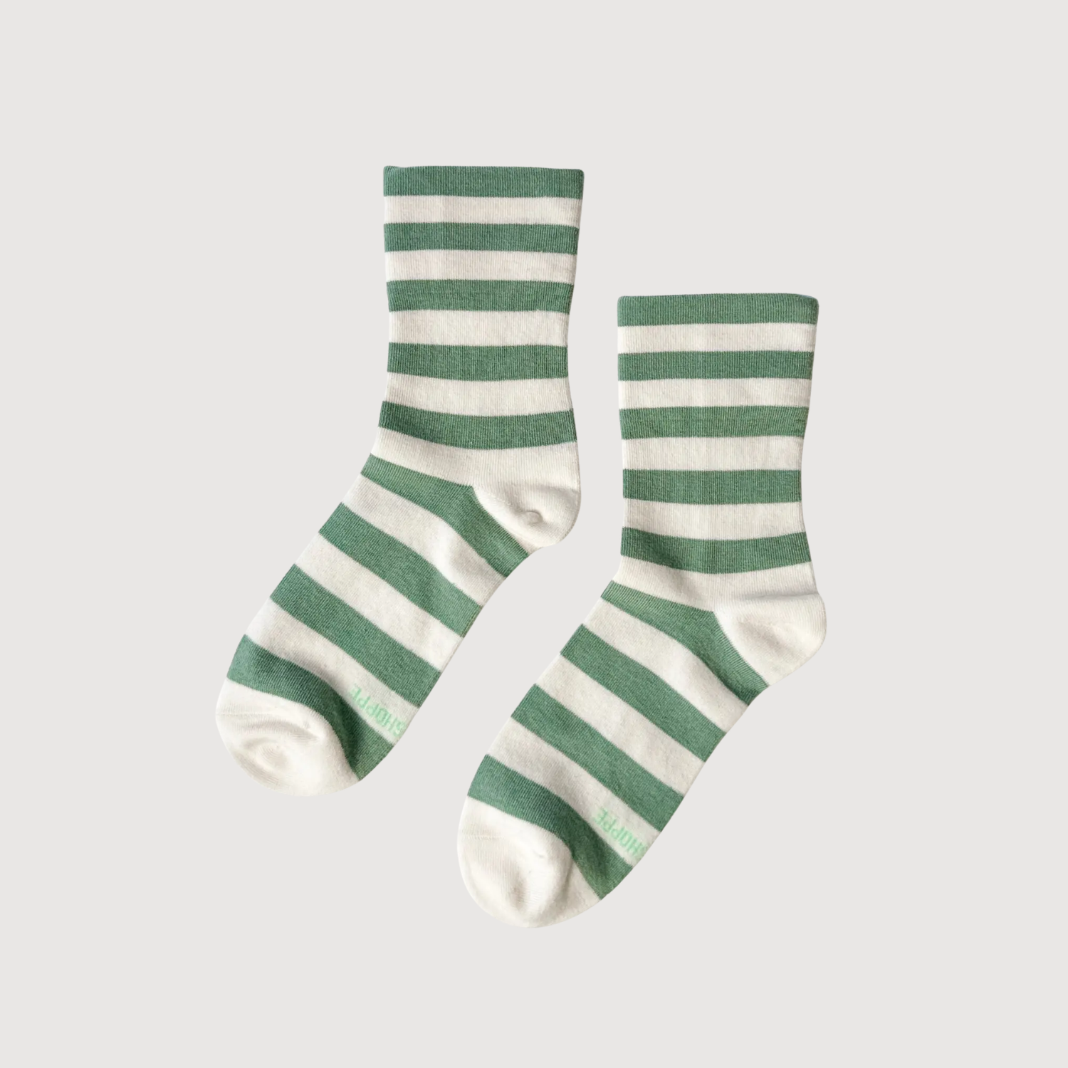 Pair of green-and-white striped crew socks with ribbed cuffs.