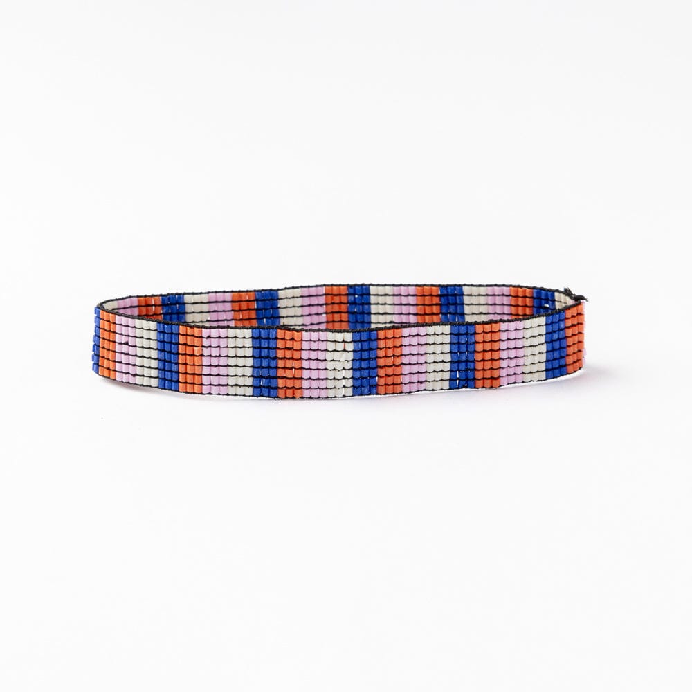 Beaded stretch bracelet with vertical multicolor stripes in blue, coral, and white