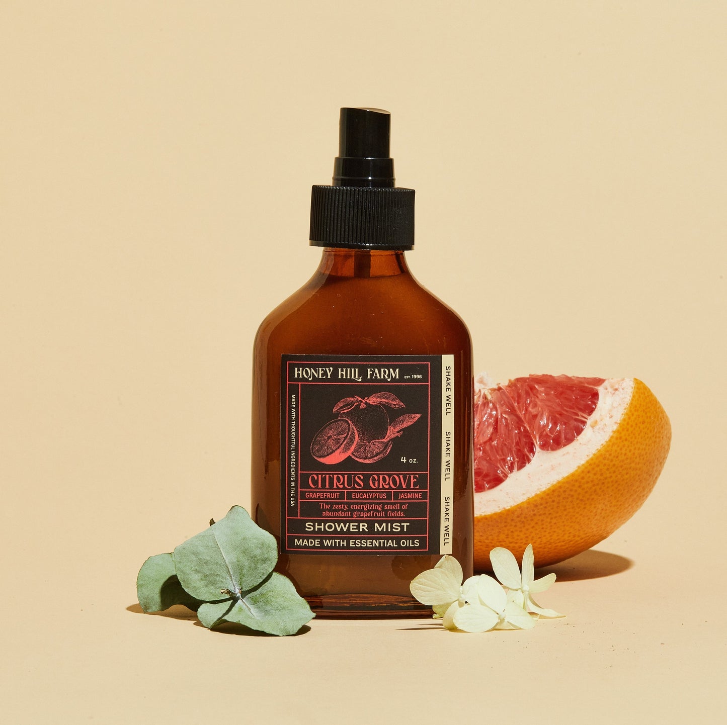 Shower mist spray bottle, amber glass and black pump; Citrus Grove scent.