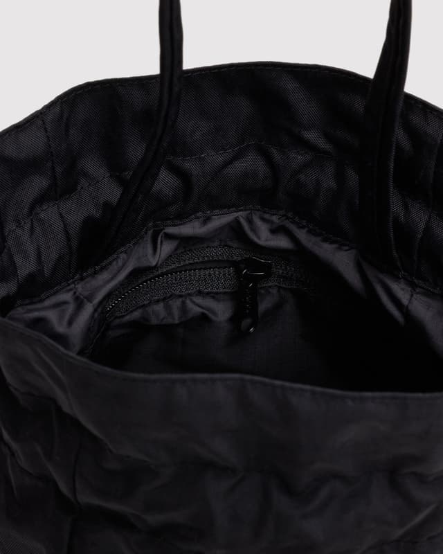 Black nylon drawstring bag with mesh lining and zip pocket inside